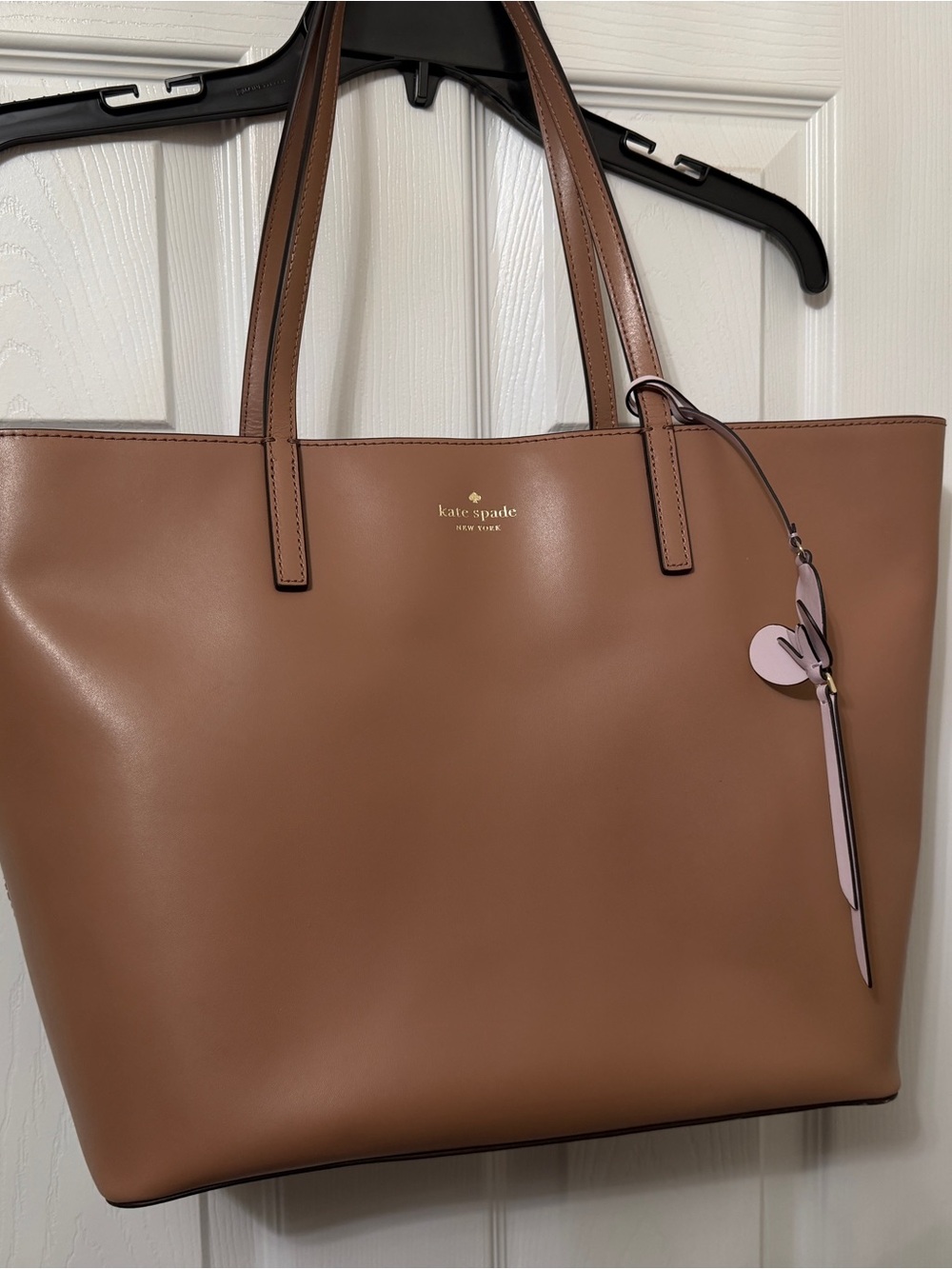 kate spade tan leather tote with pink charm